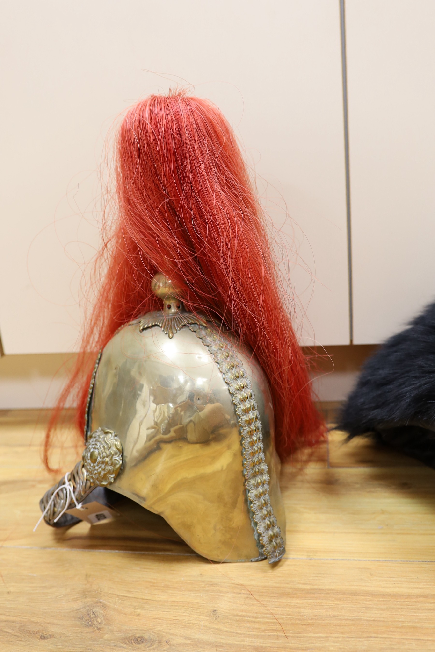 A Royal Horseguard's helmet and Queen’s guard bearskin